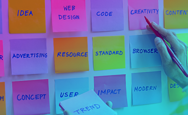 digital marketing maps out steps to a recognizable brand with sticky notes on a wall