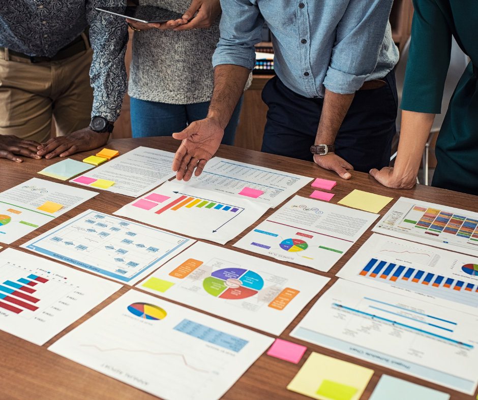 team gathers to analyze brand awareness strategy